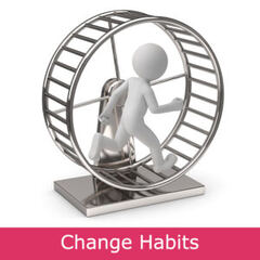 A man walking inside a hamster wheel before his hypnosis session to break bad habits.